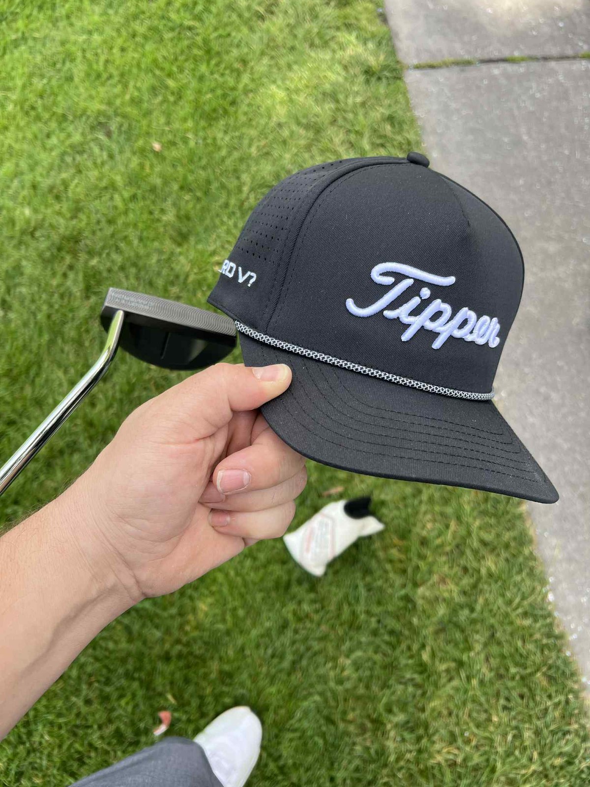 The hat out on the golf course.