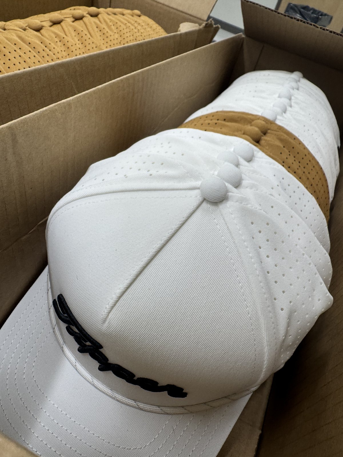 White and wheat hats, ready for packing.